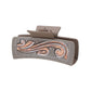 Gray scroll hair claw on white background