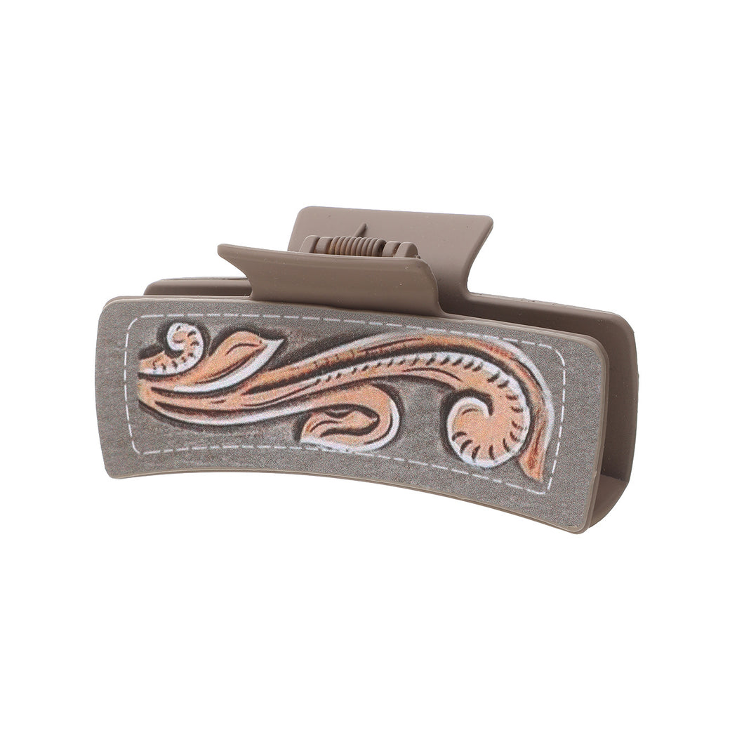 Gray scroll hair claw on white background