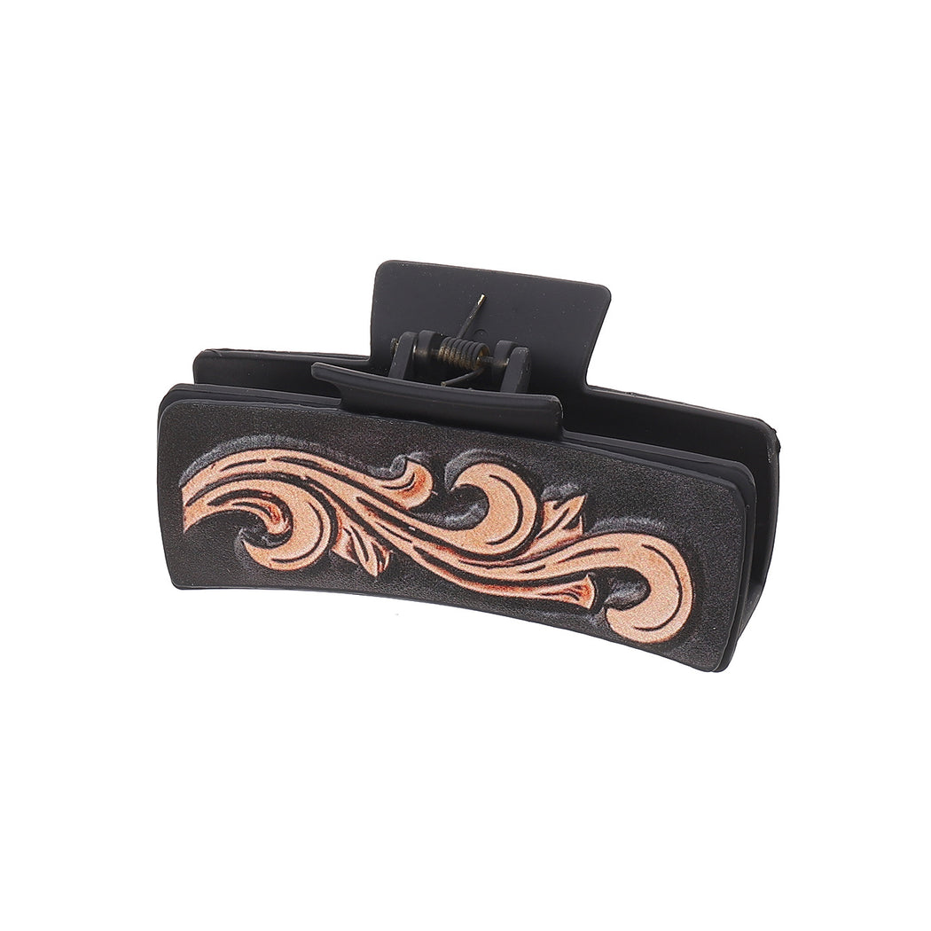 Black scroll hair claw on white background