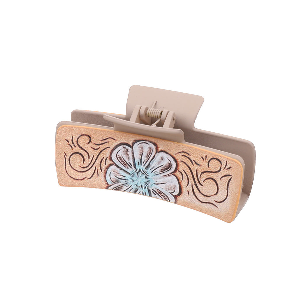 Blue floral hair claw on white background