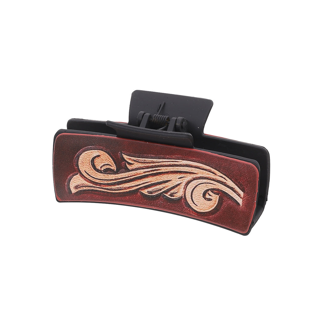 Brown scroll hair claw on white background