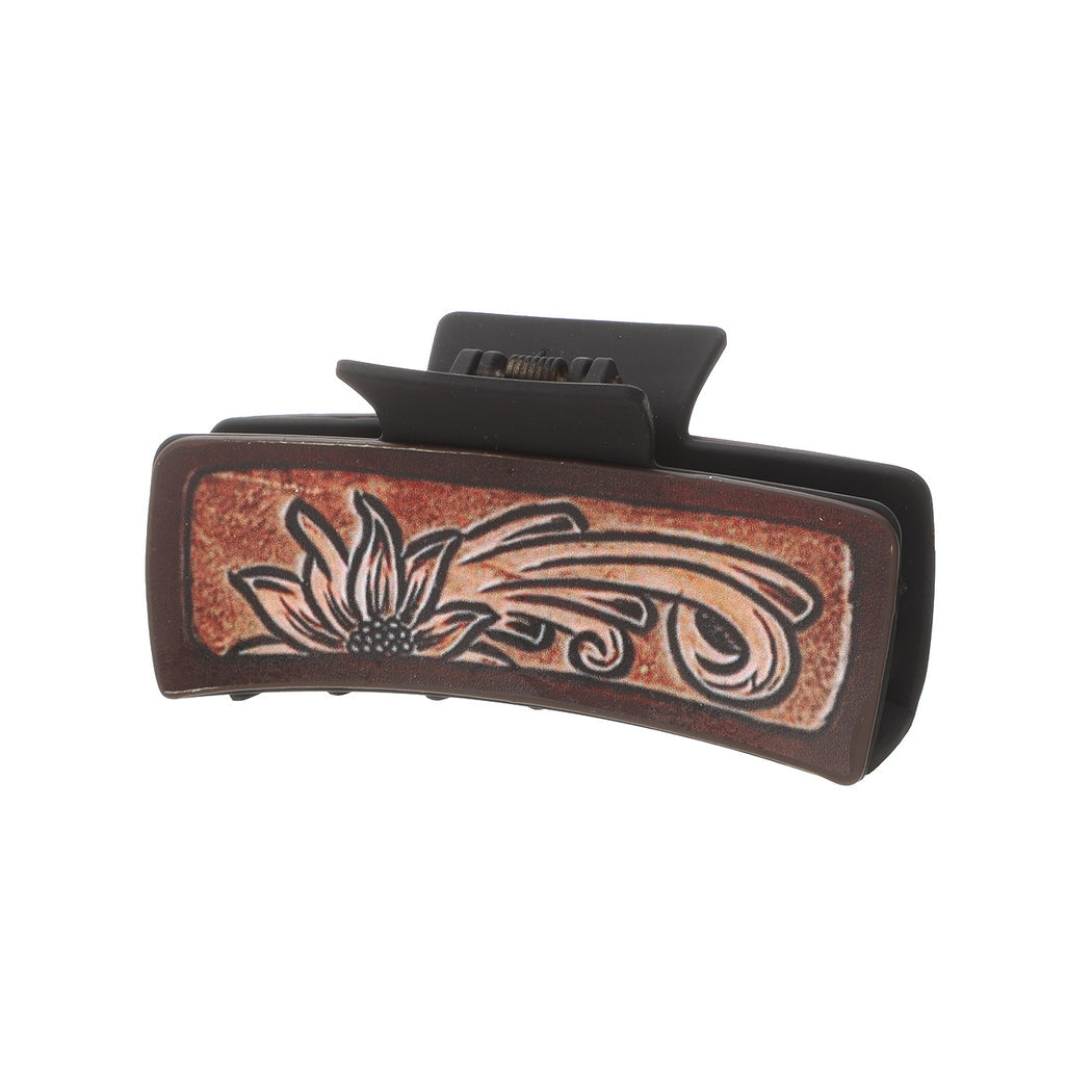 Floral scroll hair claw on white background