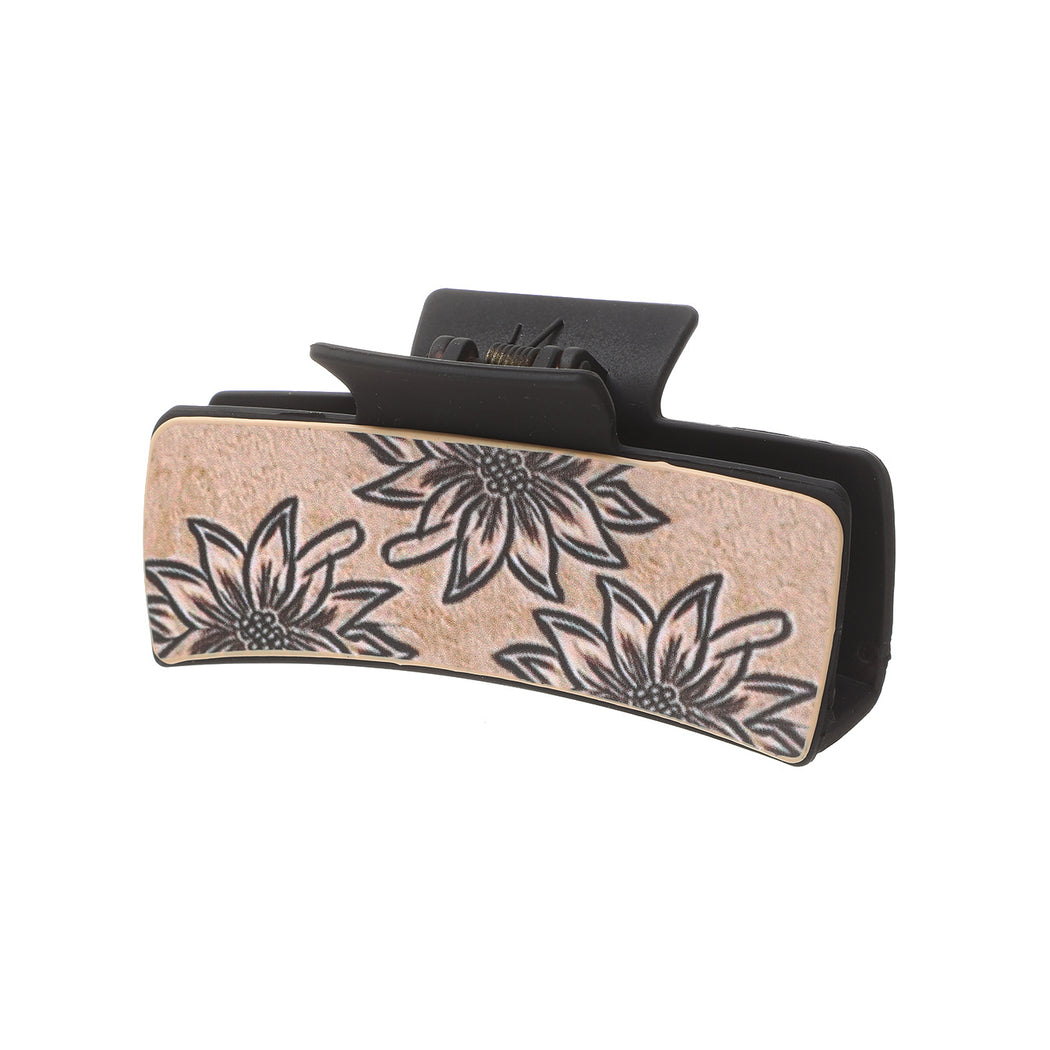 Black sunflower hair claw on white background