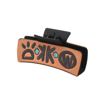 Orange western symbols hair claw on white background