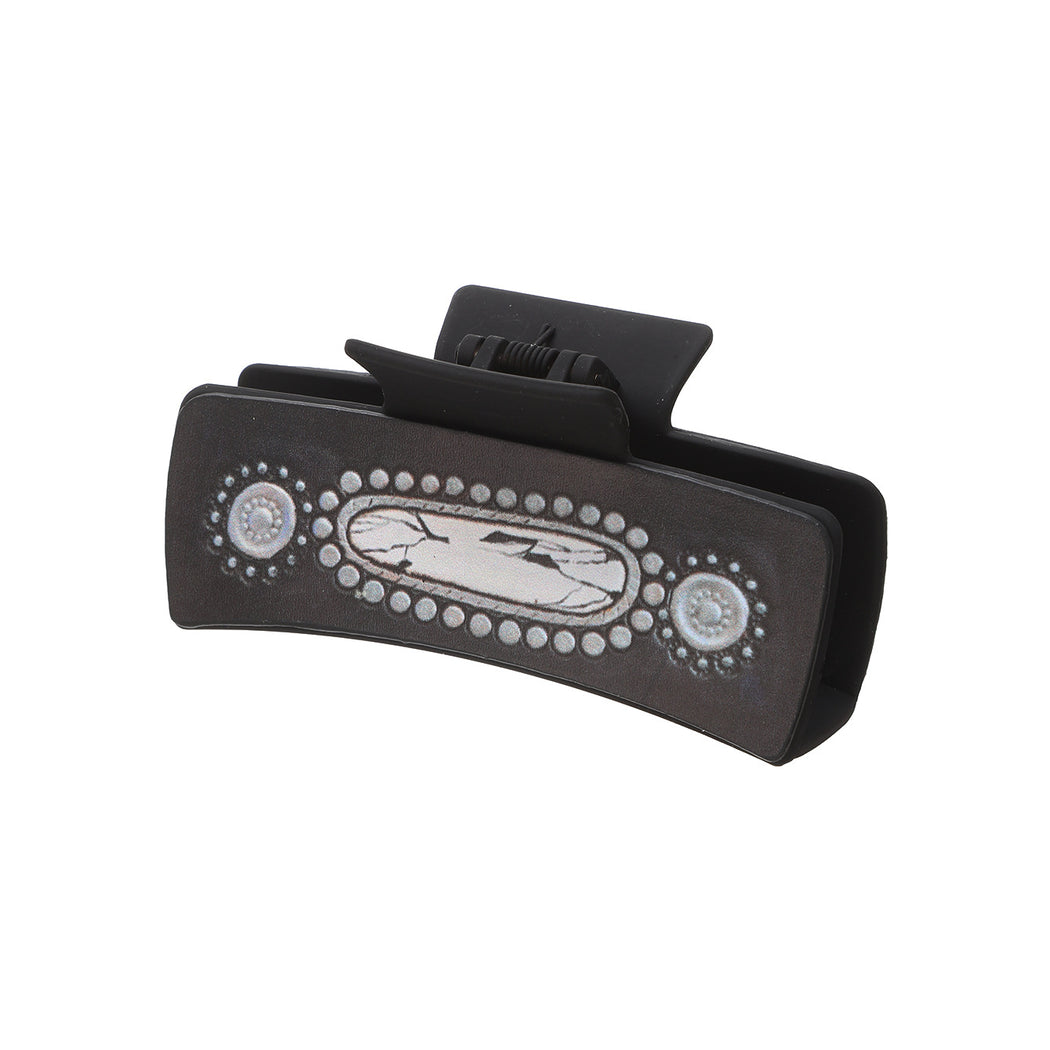 Black gem motif hair claw on white background