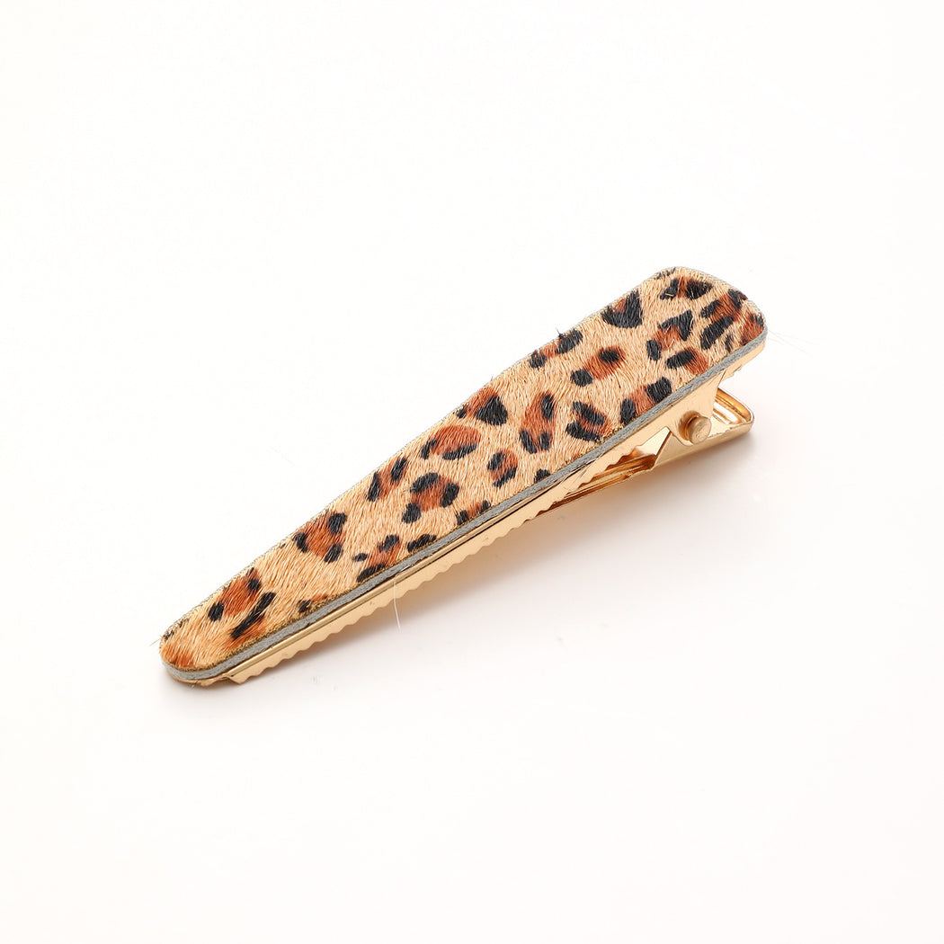 Tan leopard elongated barrette on white background