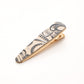 Gray floral elongated barrette on white background