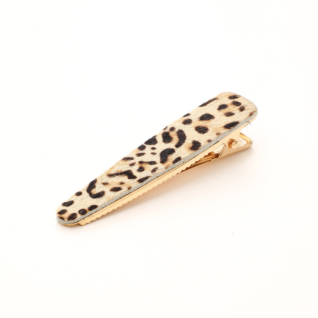 Ivory leopard elongated barrette on white background