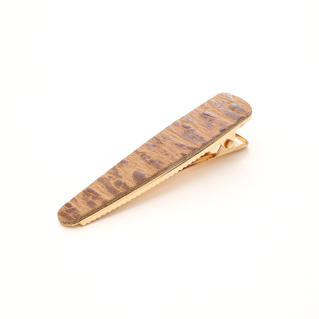 Tan crocodile texture elongated barrette on white background