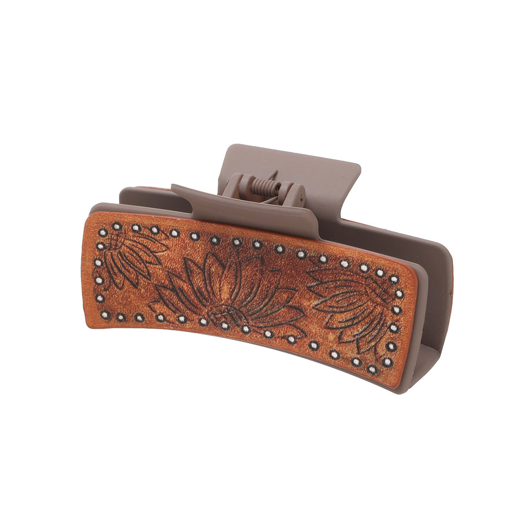 Brown floral hair claw on white background