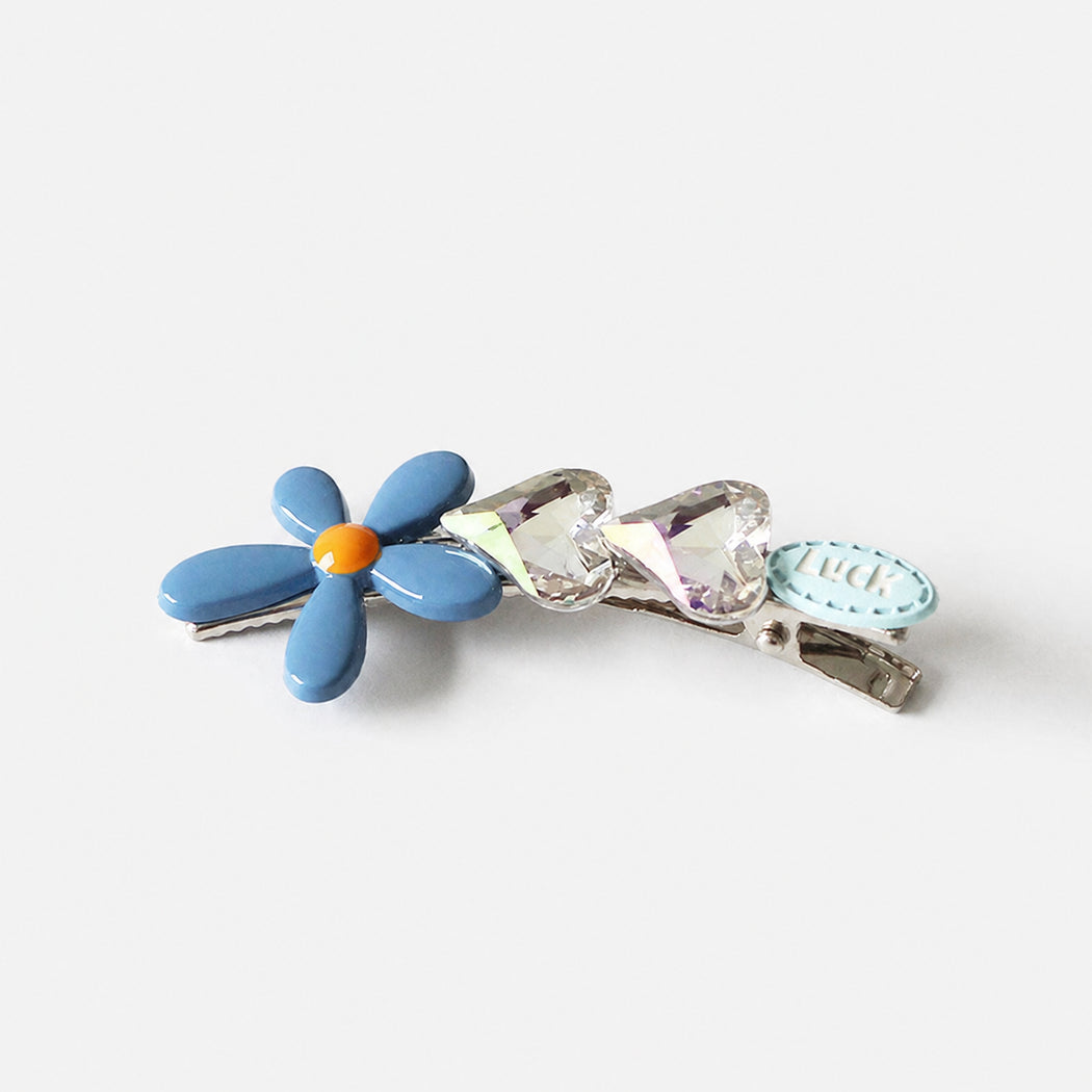 Blue floral barrette on clean white background