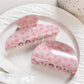 Side view of Beau Sweet Pink Floral Print Hair Claw Clip highlighting clip teeth