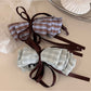Beau delicate bow hair clip displayed on a white background