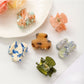 Beau fresh acetate hair clip in tortoiseshell pattern on white background