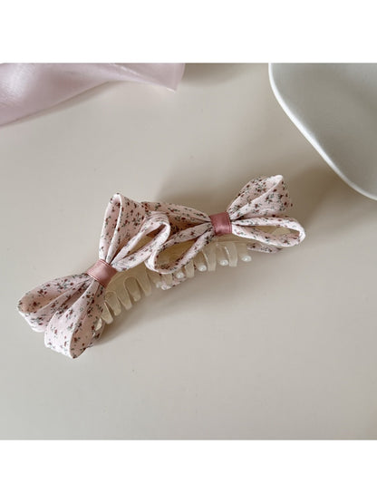 Back view of Beau printed bow banana clip showing clip teeth and fastening