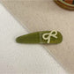 Beau - Bow Embellished Oval Hair Clip