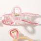 Close-up of Beau Sweet Ribbon Knot Hair Clip showing fabric texture and knot detail