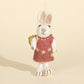 Pink dress rabbit character keychain, front view