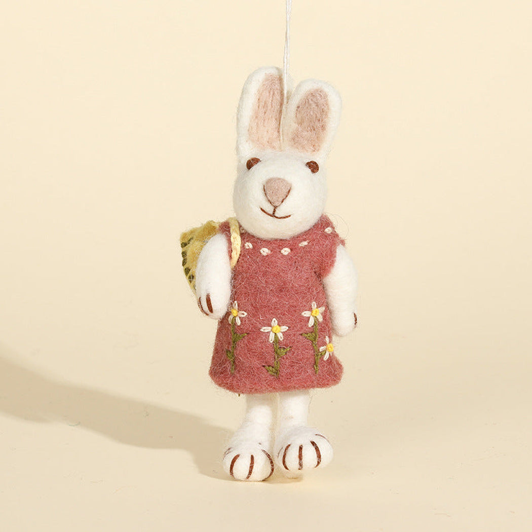 Pink dress rabbit character keychain, front view