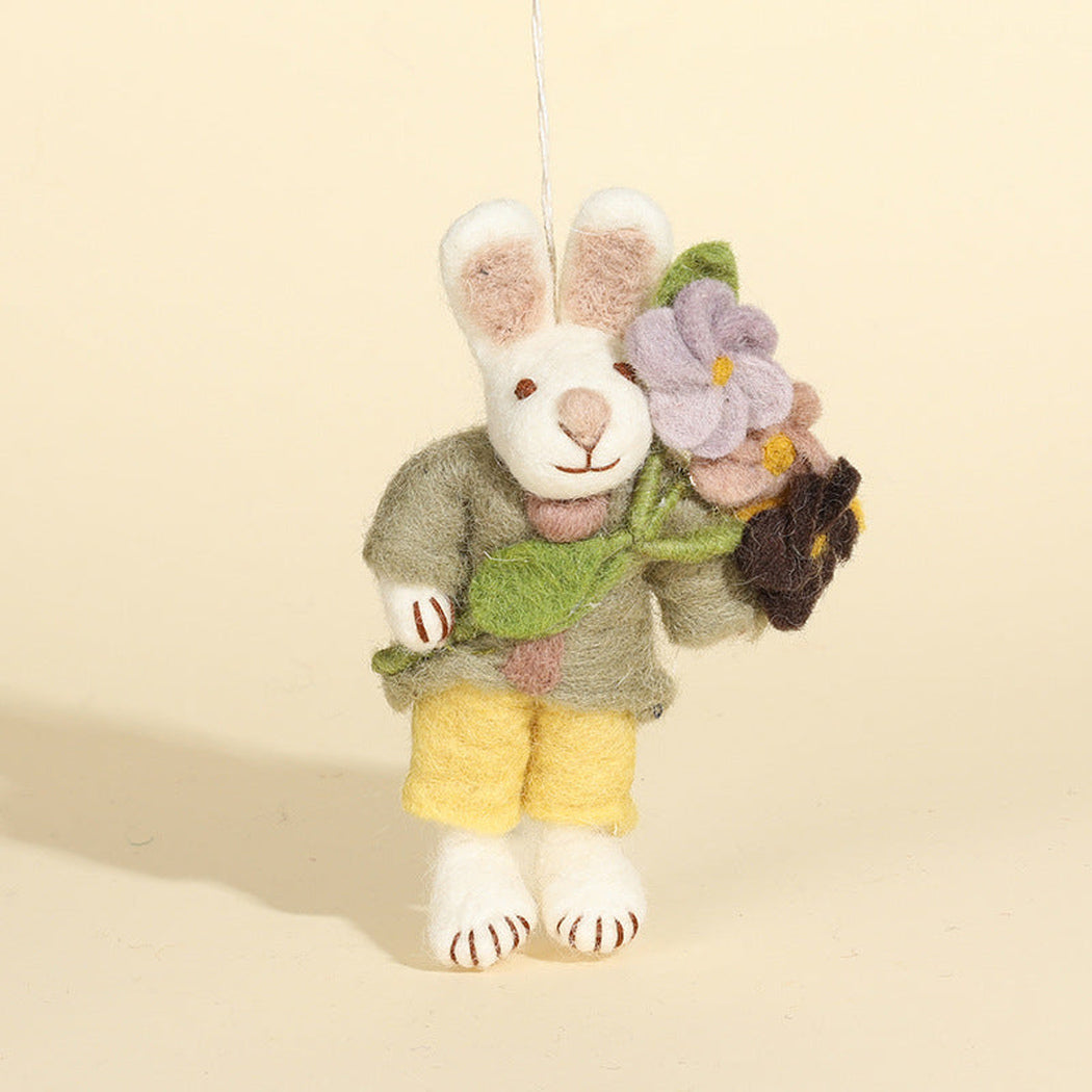 Flower-holding rabbit character keychain, front view