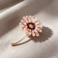 Pink-centered daisy brooch, front view