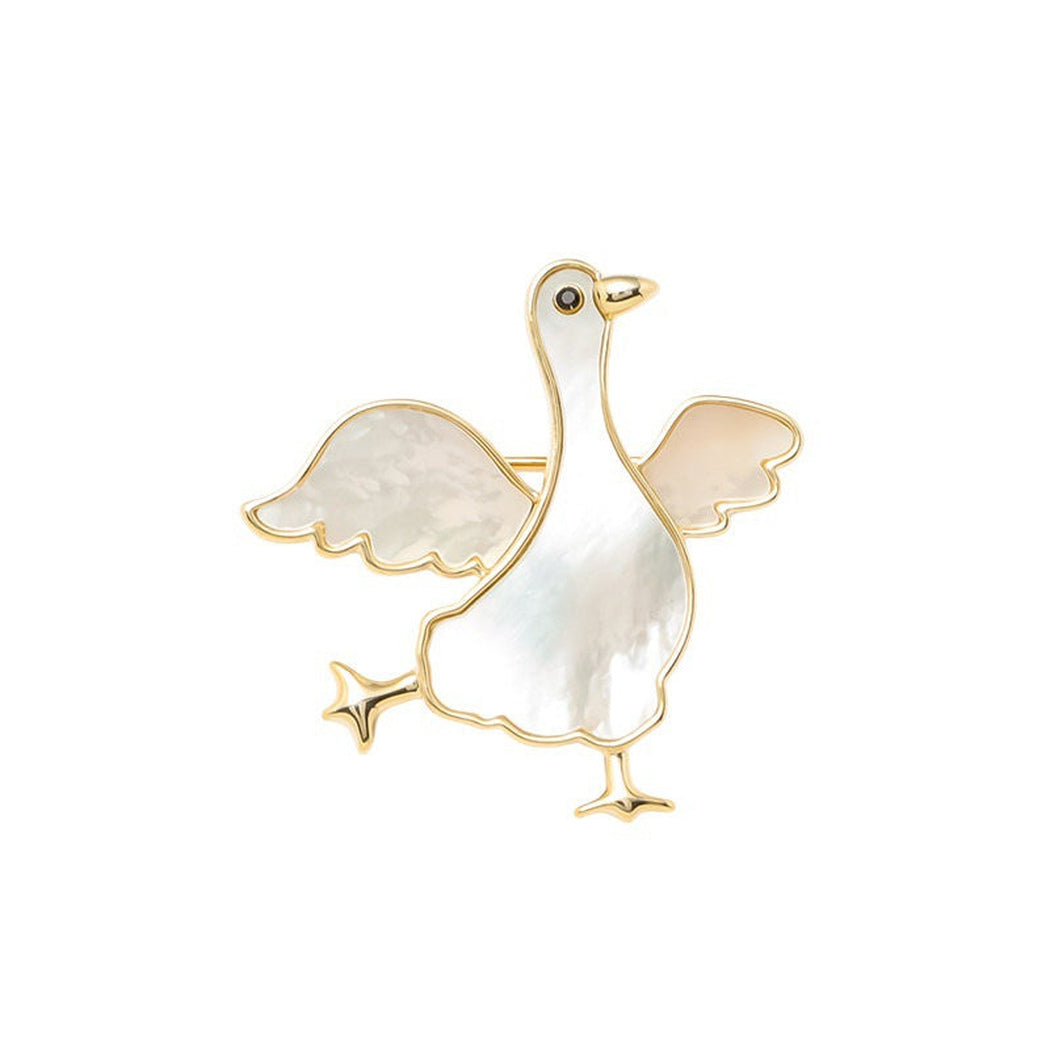 Winged goose iridescent brooch, isolated front view