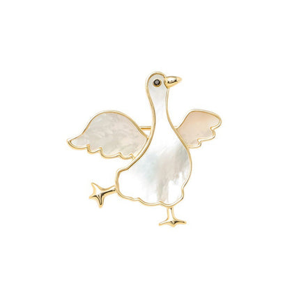 Winged goose iridescent brooch, isolated front view