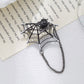 Halloween spiderweb drape chain brooch, front view