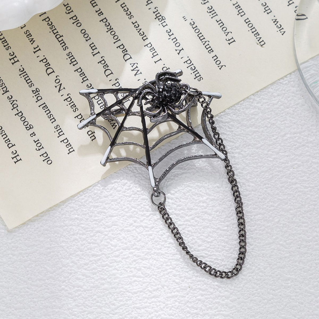 Halloween spiderweb drape chain brooch, front view
