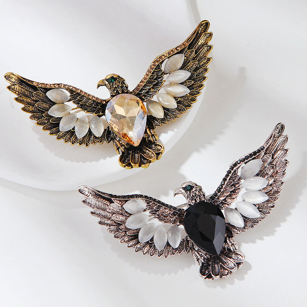 Spread-wing eagle heart accent brooch in two visible styles, overview