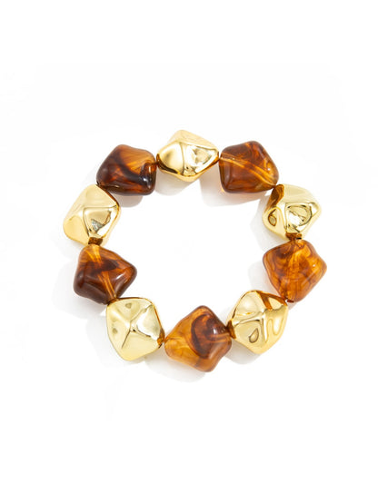 Lovra vintage beaded link bracelet displayed with complementary jewelry pieces