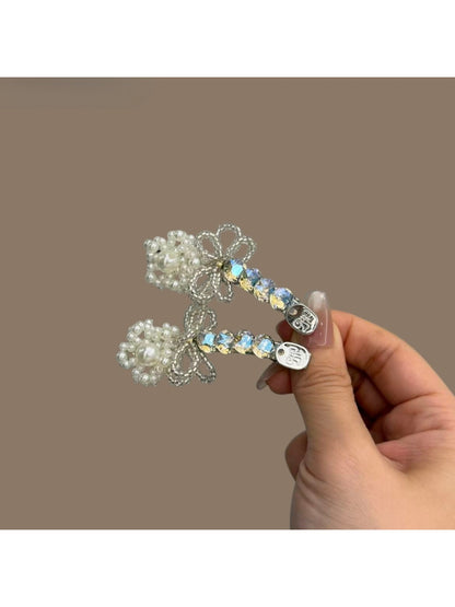Beau bow hair clip worn in styled hair, highlighting sparkle and design