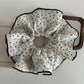 Gifty floral scrunchie worn in hair, highlighting size and pattern
