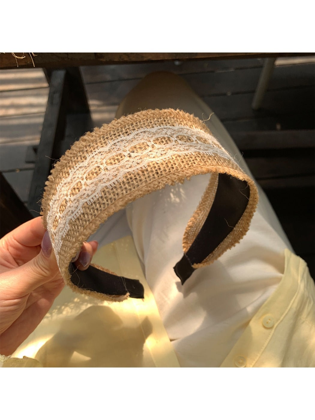 Top view of soft straw lace headband showing intricate weaving and lace design