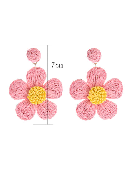 Side view of Earedge minimalist flower drop earrings showing delicate design