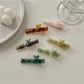 Close-up of Beau sweet cute acetate hair clip with tortoiseshell pattern