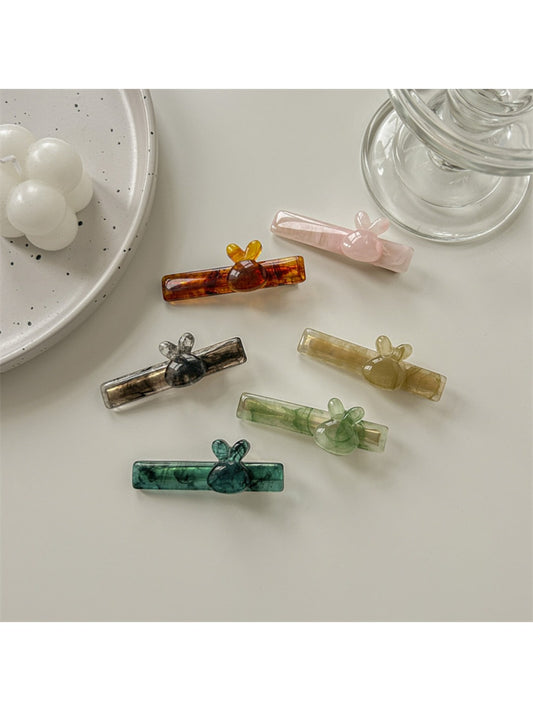 Close-up of Beau sweet cute acetate hair clip with tortoiseshell pattern