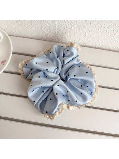 Gifty sweet polka dot lace trim scrunchie styled in a casual hair bun