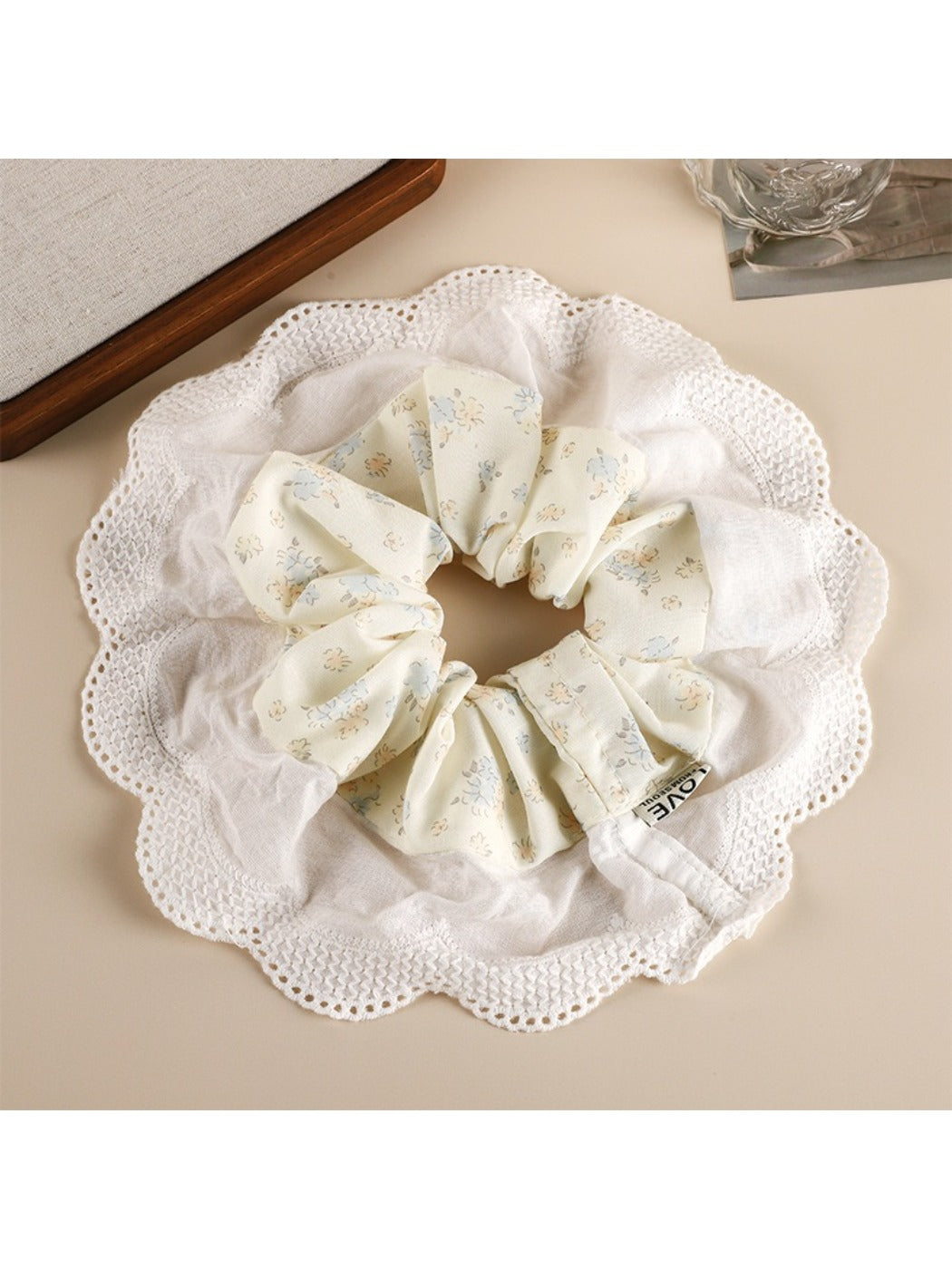 Gifty scrunchie wrapped around a ponytail, showcasing vibrant patchwork design