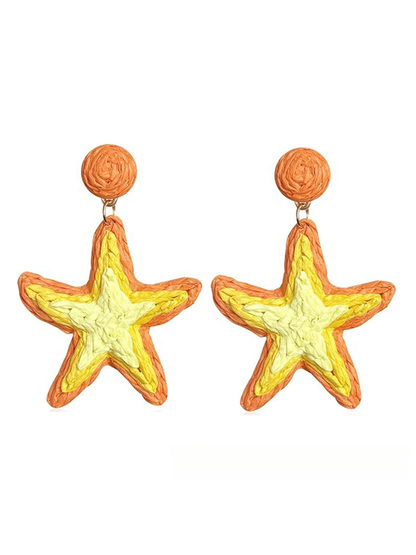 Earedge Starfish Raffia Woven Stud Earrings resting on a wooden surface