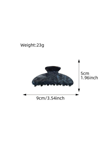 Beau claw clip open to show metal spring mechanism and teeth