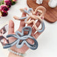 Beau heart shaped bow claw clip held in hand displaying size and ombre color effect