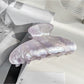 Top view of Beau claw clip emphasizing pearlescent color and shape