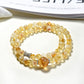 Lovra yellow crystal multi-wrap bracelet displayed on a white background