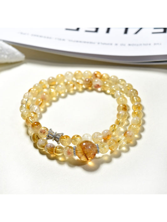 Lovra yellow crystal multi-wrap bracelet displayed on a white background