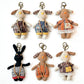 Back view of the fabric puppy keychain displaying plain fabric and keyring attachment