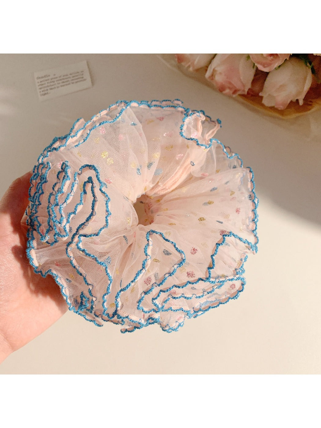 Close-up of Gifty Hazy Elegant Mesh Scrunchie in soft pastel color on white background