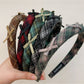 Close-up of Gifty plaid bow headband fabric texture and pattern