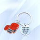 Close-up of alloy boxing glove shaped keychain with detailed texture