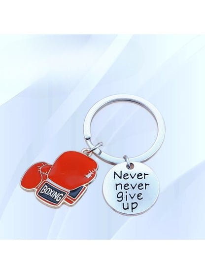 Close-up of alloy boxing glove shaped keychain with detailed texture
